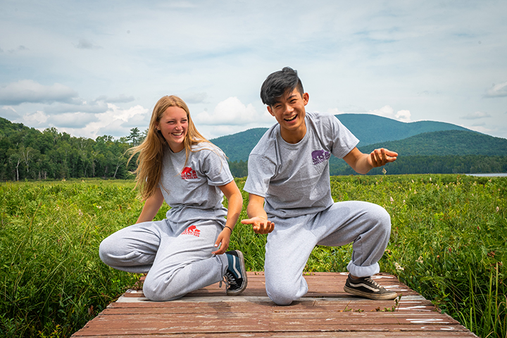 boy and girl camper wearing branded clothing