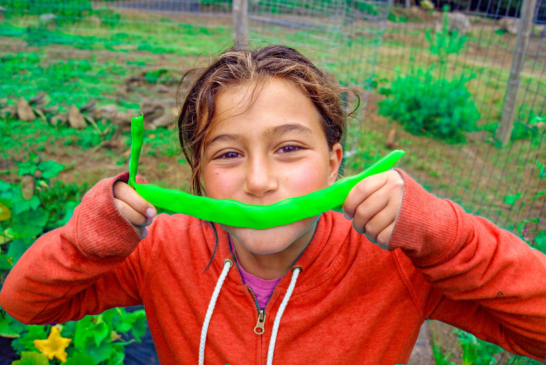 camper smiling with veggie
